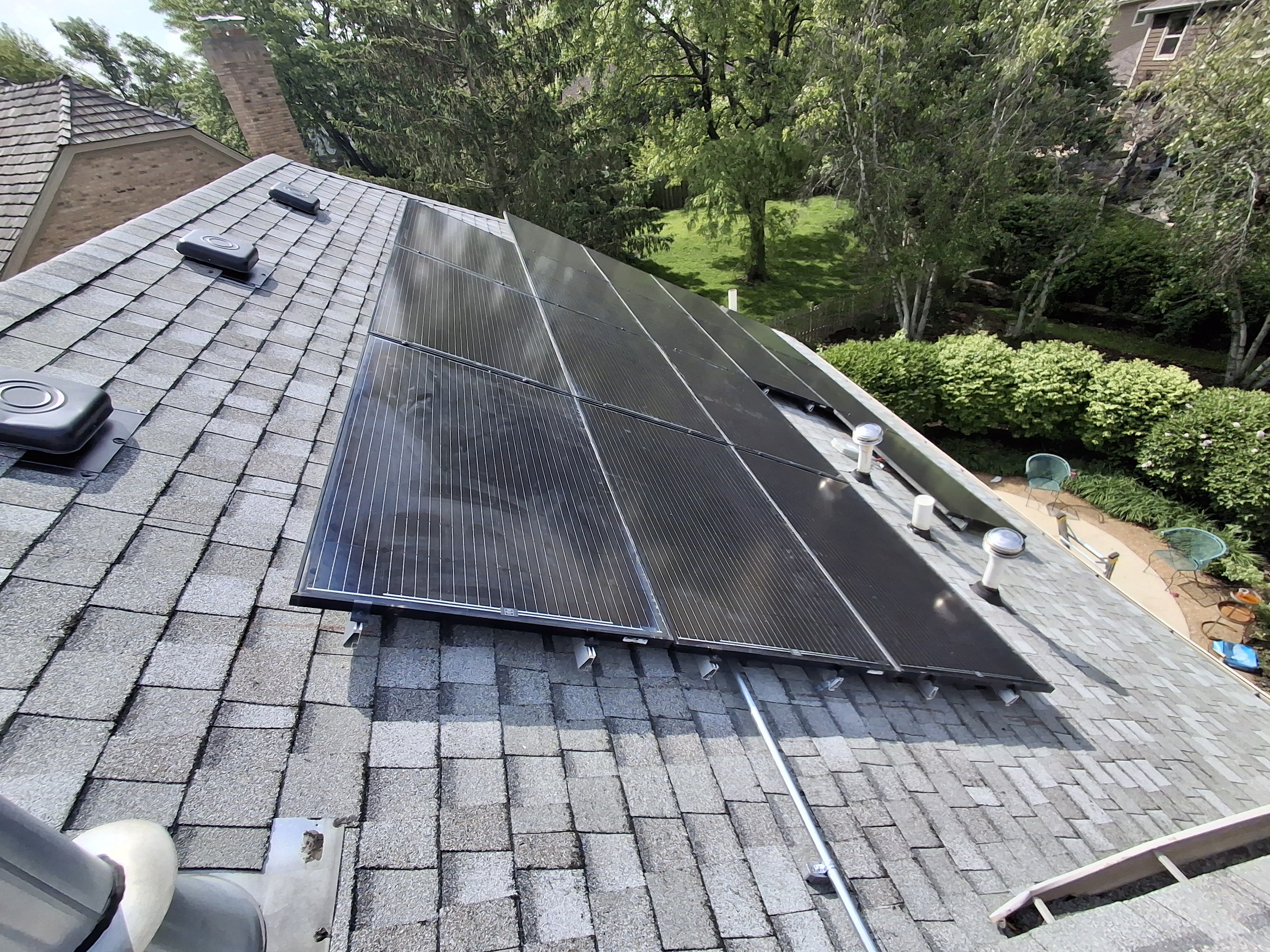 Close-up solar panel array shingle roof Illinois