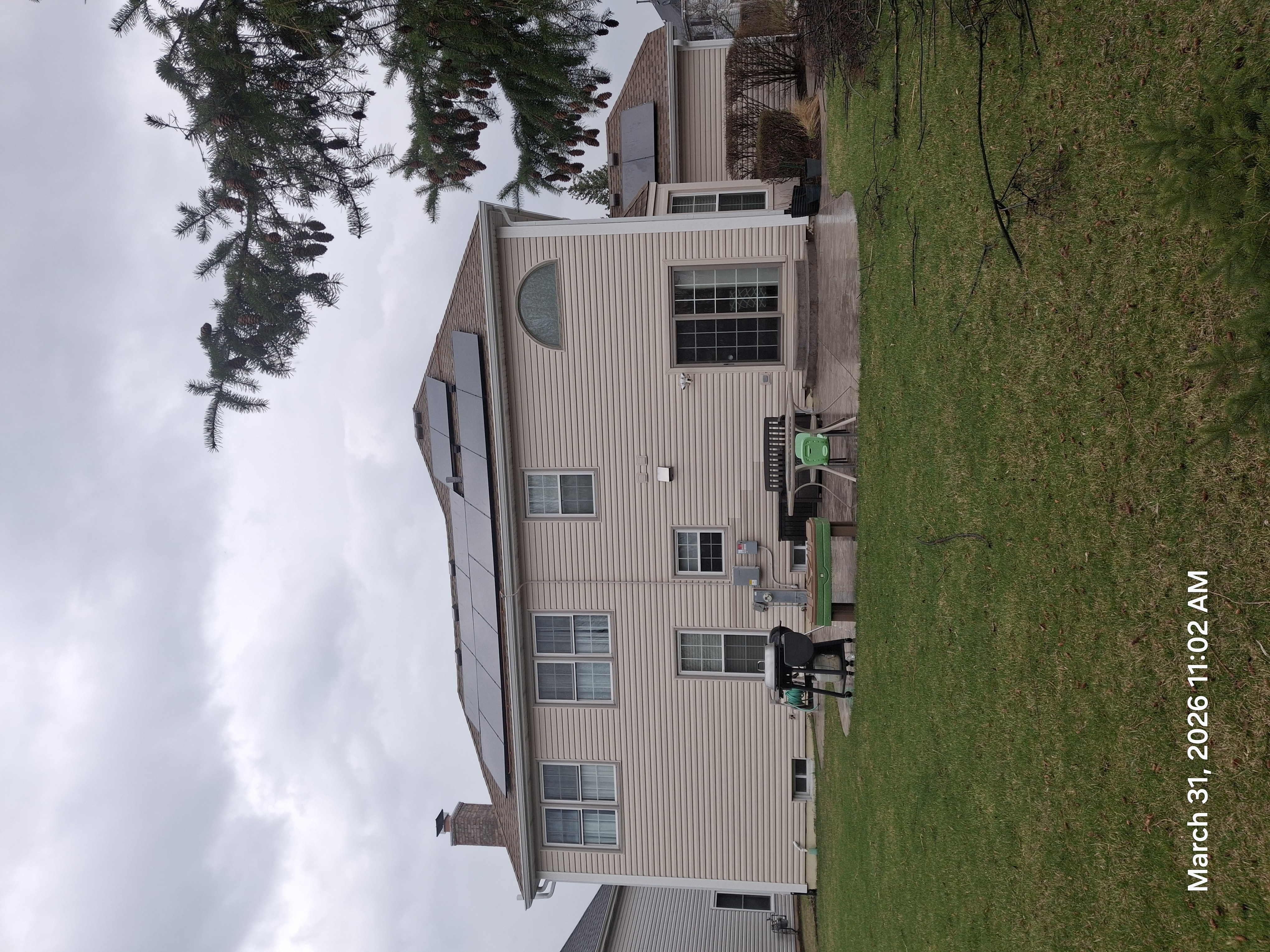 Rooftop solar rear view Illinois home backyard