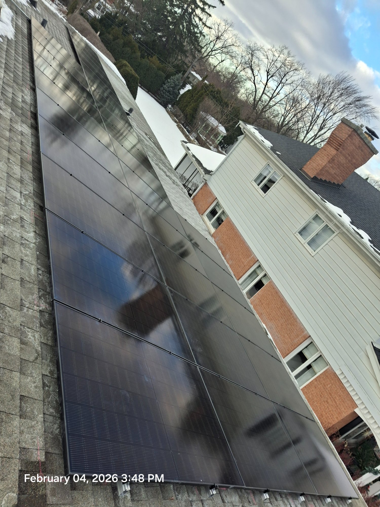 Rooftop solar winter installation Illinois brick home